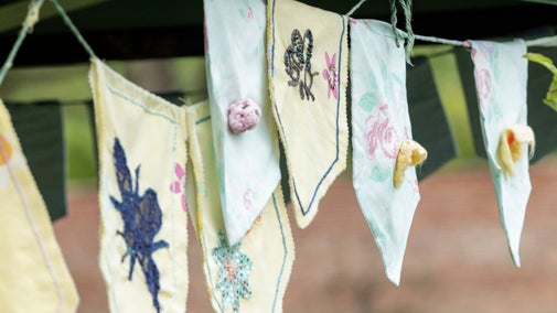 Close up of individually designed bunting flags on a string